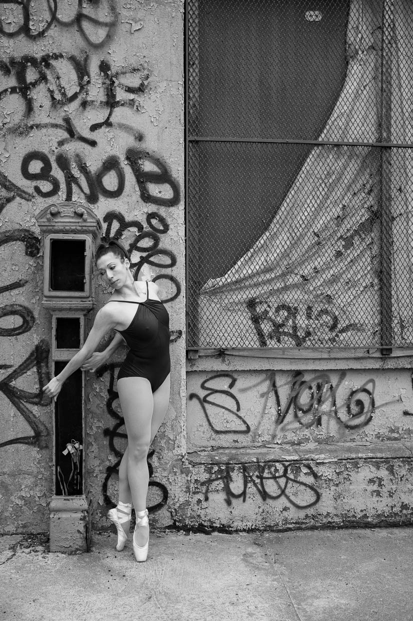 ballerina dancing with an abandoned call box