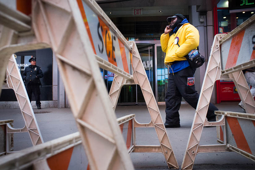 nyc street photography with cop and metro worker