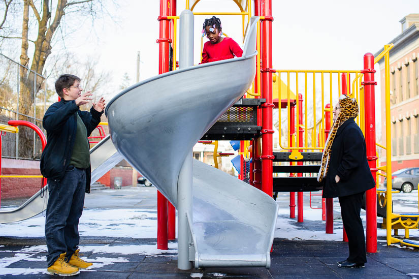 family playing on a playground