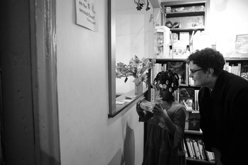 little girl and her mom in a bookstore