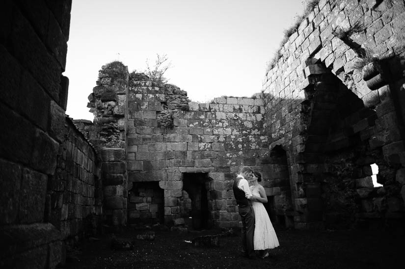 bride and groom portraits in castle ruins in north yorkshire, england