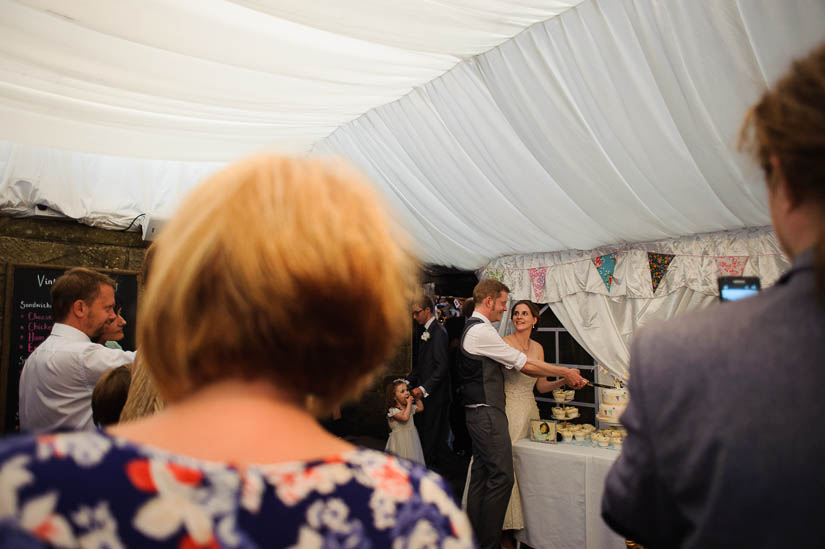 cutting the cake at danby castle wedding