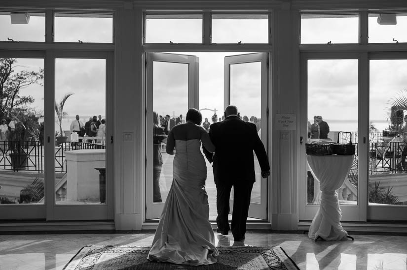 bride and her father going out to the ceremony