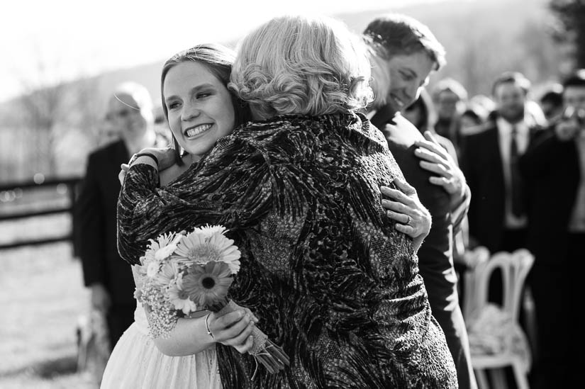 hugging her mom at the bluemont vineyard wedding