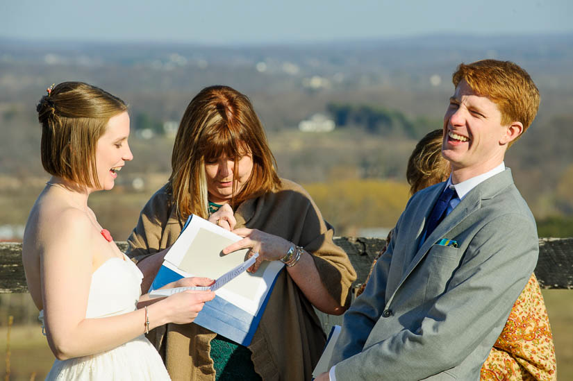 laughing during the wedding ceremony at bluemont vineyard