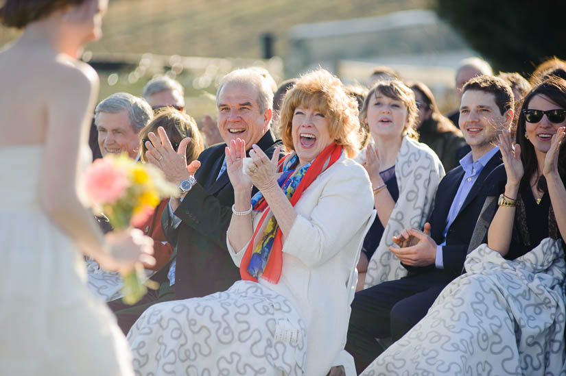 mother of the groom smiling during wedding recessional