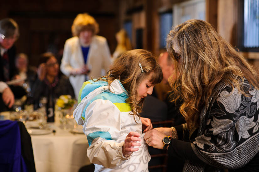 little girl being zipped up for the cold at bluemont vineyard