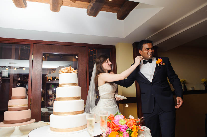 smashing the cake in his face at comus inn wedding