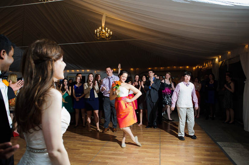 bridesmaid catches the bouquet at comus inn wedding