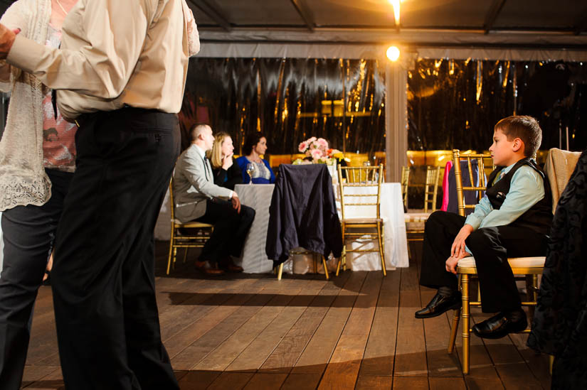 little boy tired at flying bridge wedding