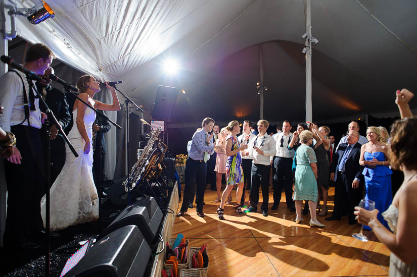 bride on the microphone at green spring valley hunt club wedding