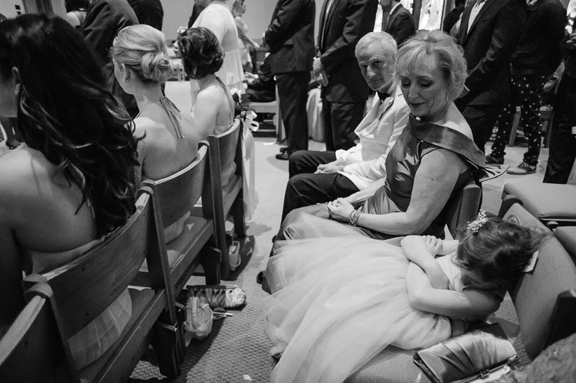 little girl sleeping during wedding ceremony