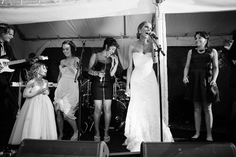 bride on stage with escapade at green spring valley hunt club wedding