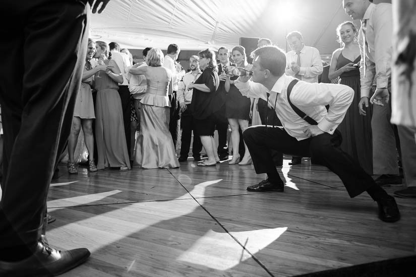 groom playing a dancing game at green spring valley hunt club wedding