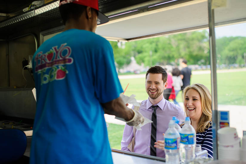 getting frozen yogurt during engagement photo shoot