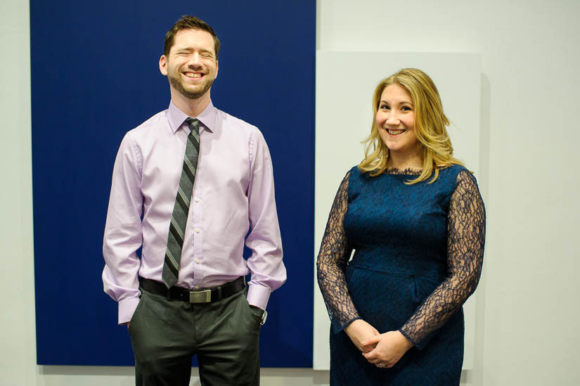 blue and white engagement photos in a museum