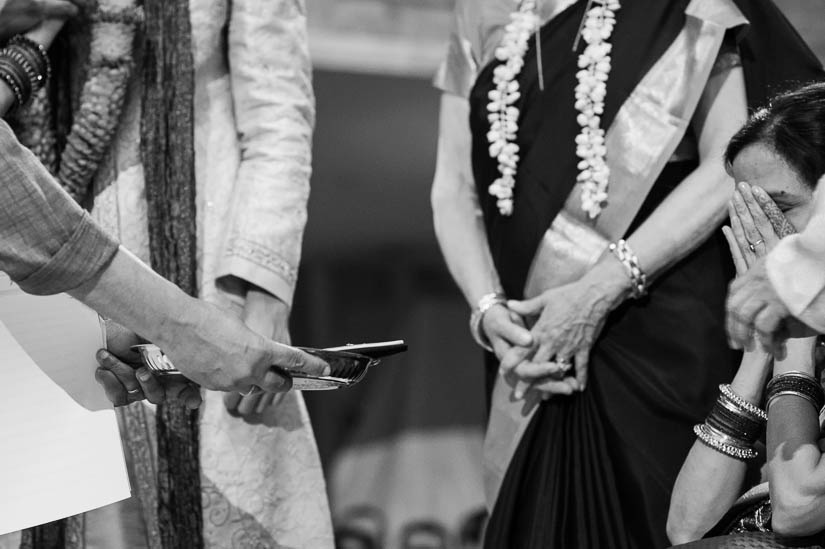 praying at the hindu wedding ceremony at national museum for women in the arts