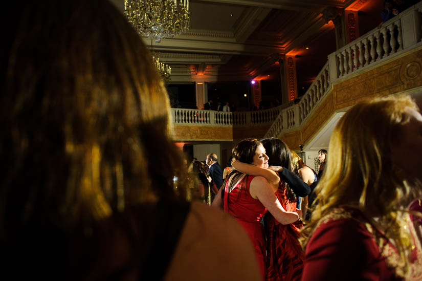 wide angle hug photo at national museum for women in the arts wedding