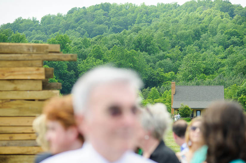 bride and her father coming a long way to the wedding ceremony