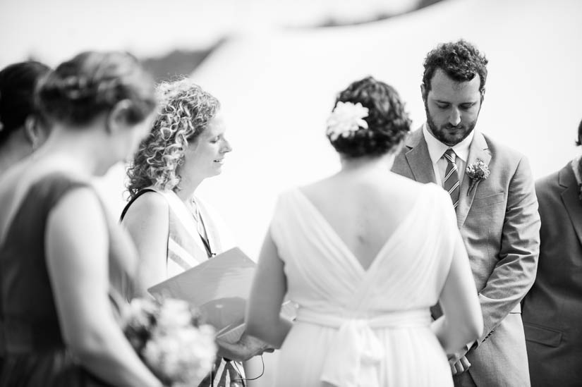 praying during the wedding ceremony in charlottesville countryside