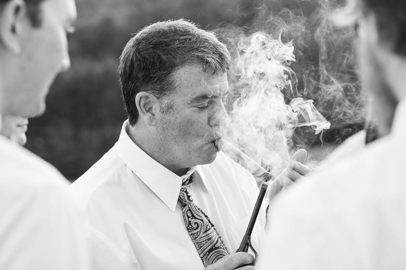 dad smoking cigars at charlottesville country wedding