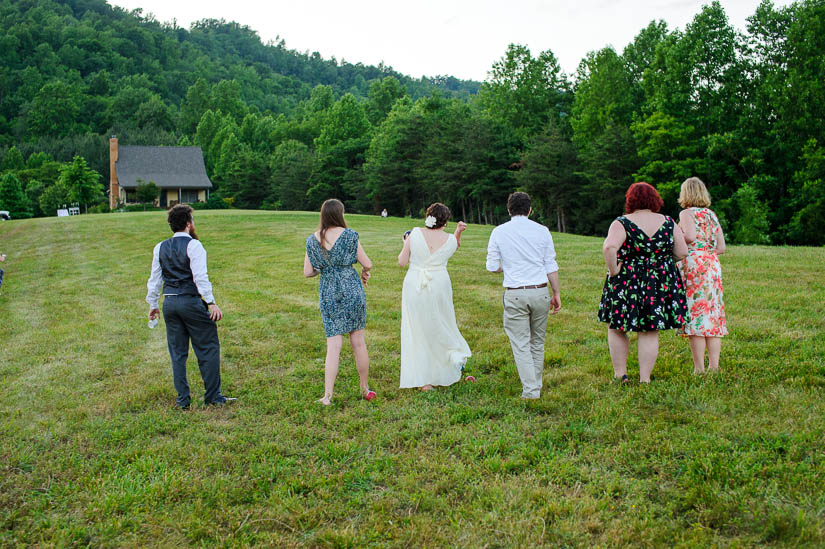 playing bocce ball at twilight in charlottesville wedding