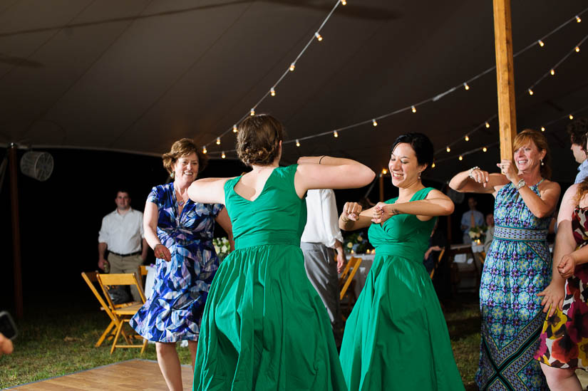 bridesmaids dancing at tented wedding reception at a private residence