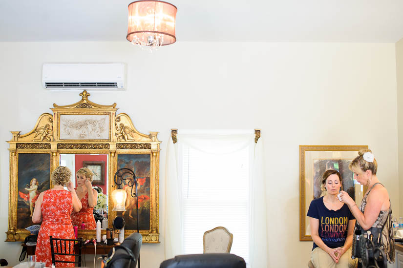 bride and her sister getting ready at historic rosemont manor wedding