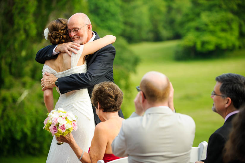 bride hugs her dad at historic rosemont manor wedding