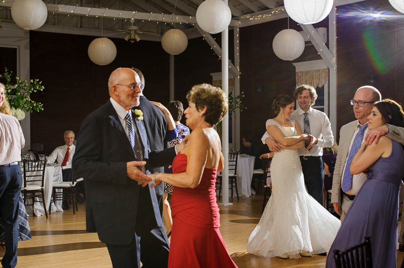 bride and groom and her parents dancing at historic rosemont manor wedding