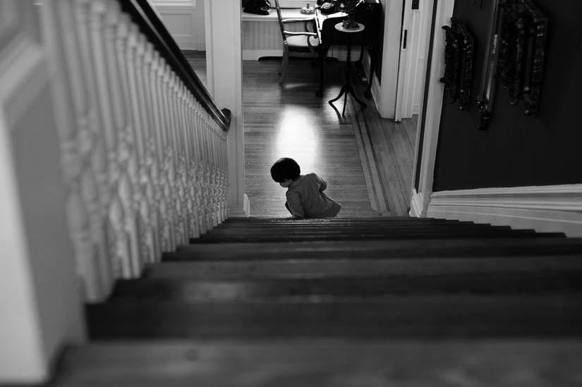 little boy on the stairs at historic rosemont manor wedding