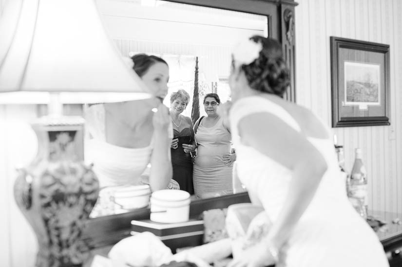 mother of the bride watches her daughter