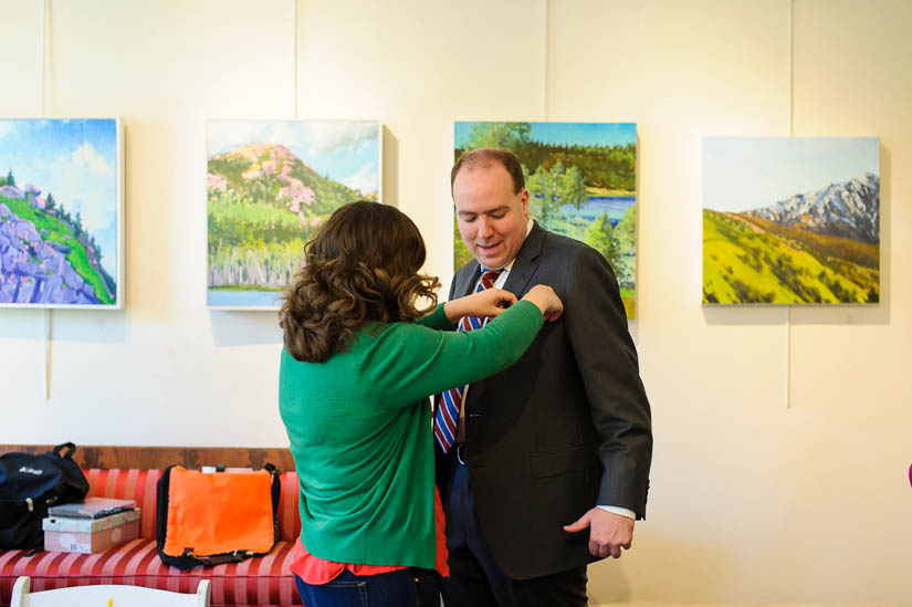 bride and groom getting dressed at arts club of washington wedding