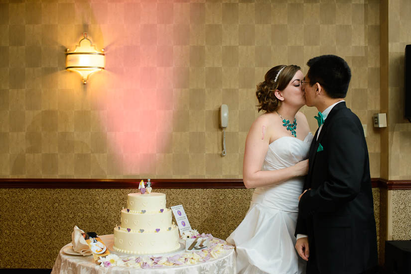 bride and groom during cake-cutting in Crowne Plaza Crystal City wedding