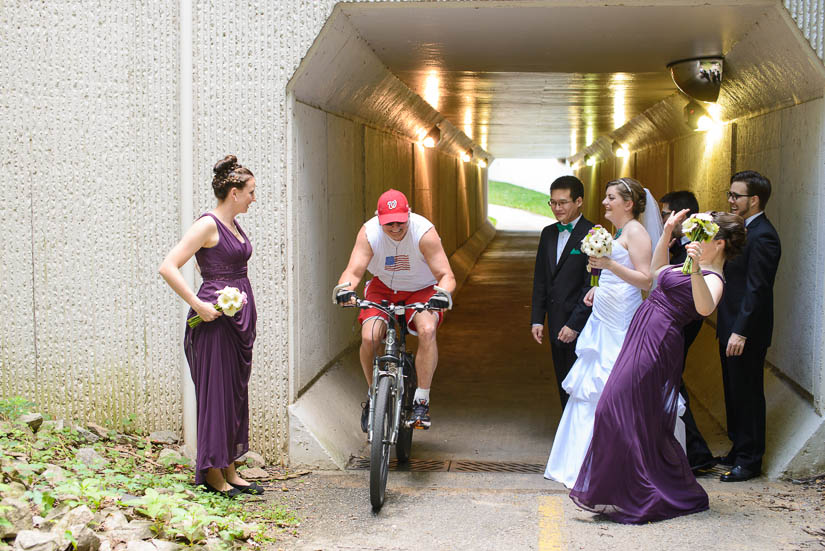 biker cuts through bridal party pictures in arlington, va