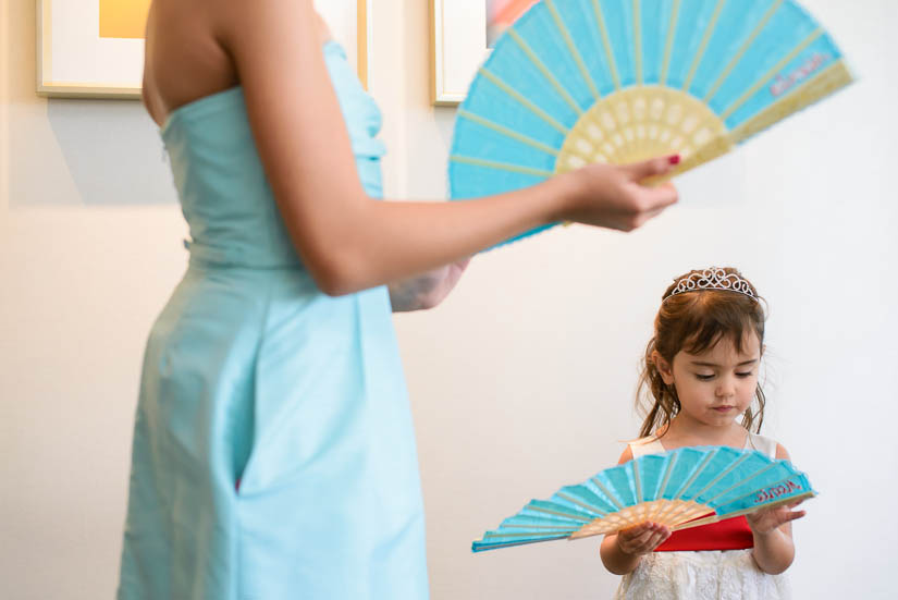 little girl with baby blue fans