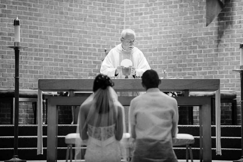 bride and groom during mass