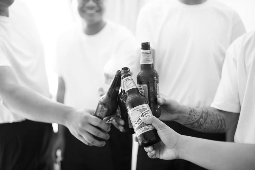 groom and groomsmen toast before the wedding