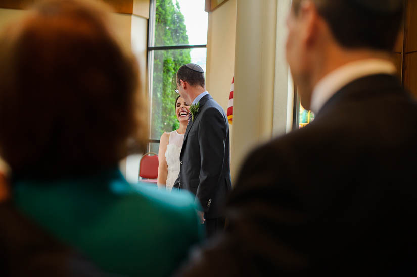 bride and groom laughing through the parents