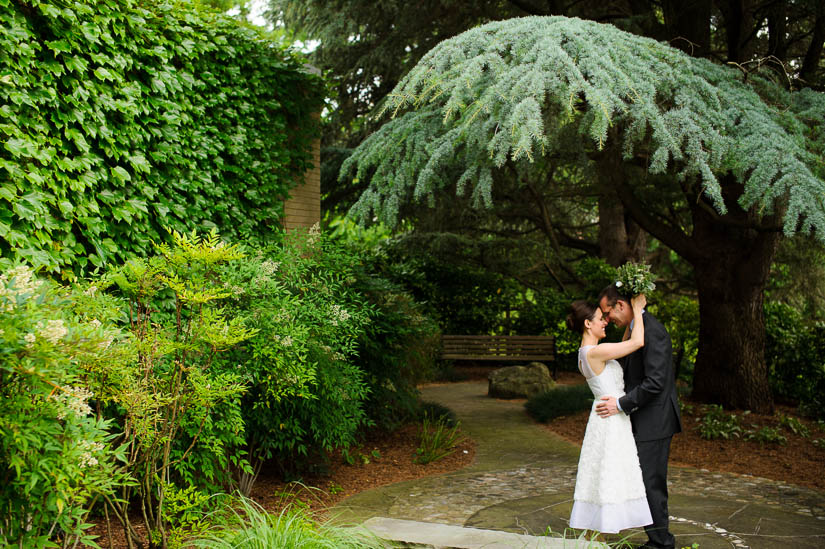 portraits of the bride and groom in the temple garden