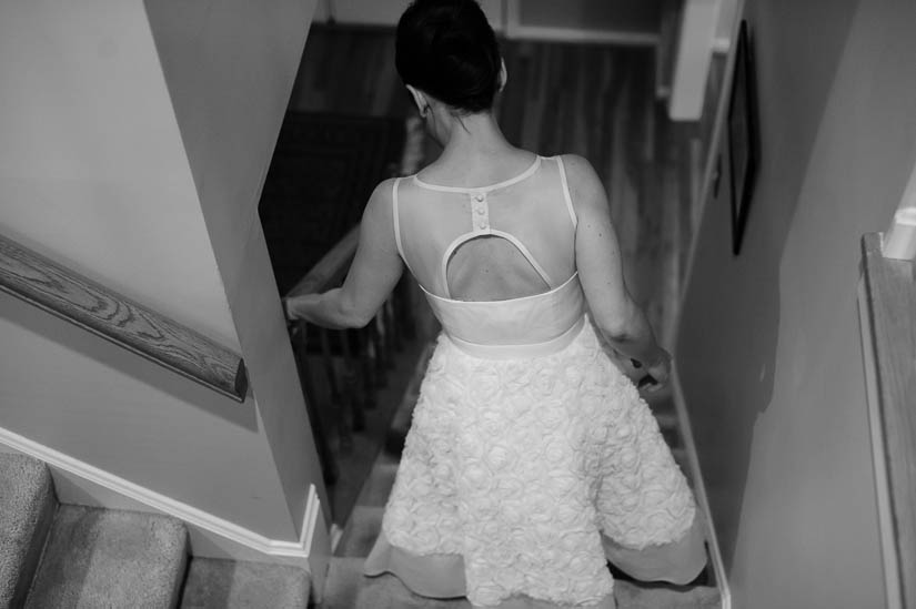 walking down her family stairs before the wedding