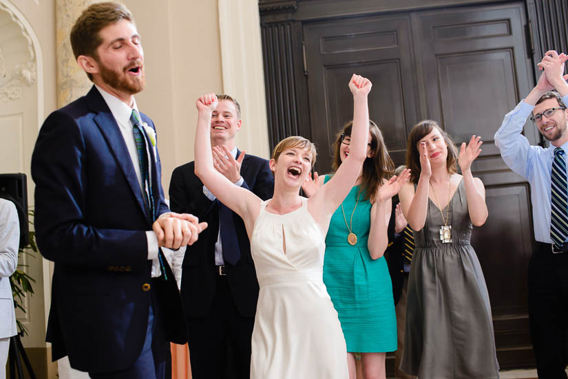 bride and groom celebrating the end of the wedding