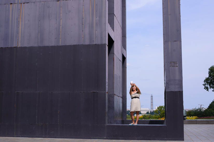 taking pictures with the washington monument in the background