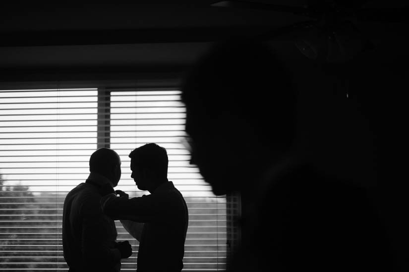 groom and groomsmen getting ready at home