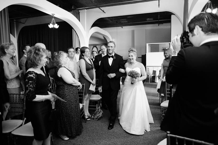 bride walking down the aisle with her father