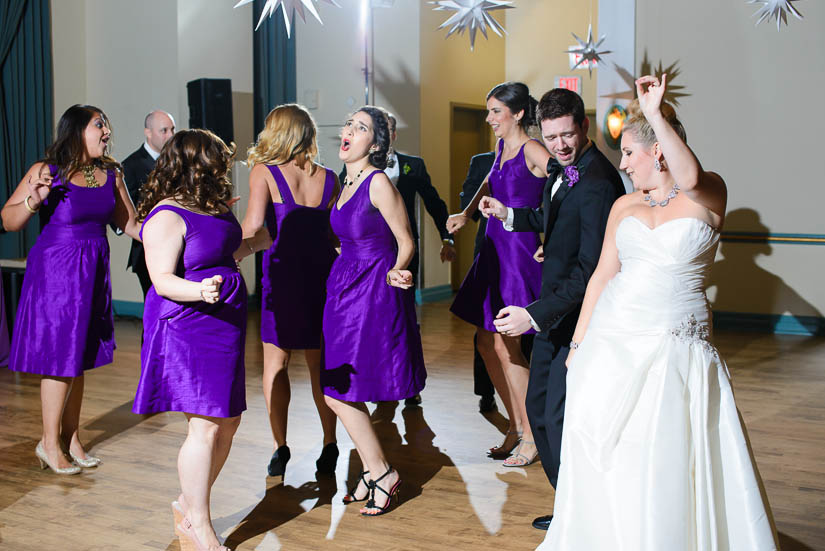 wedding party dances into the reception with boogie shoes