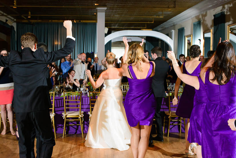 wedding party takes their seats before the reception