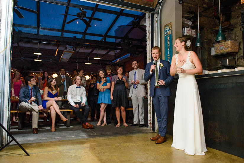 bride and groom give a speech at american ice co wedding