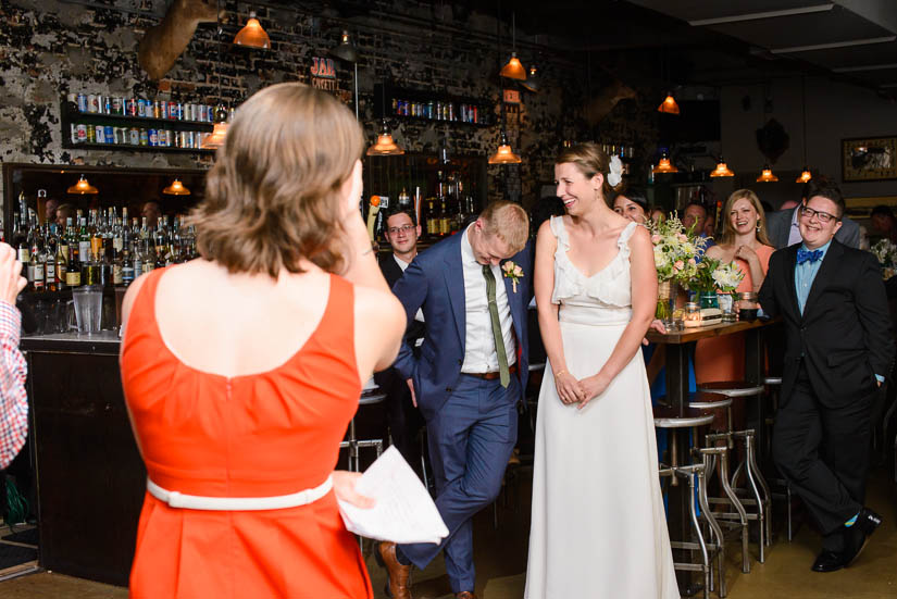 bride and groom react to speeches