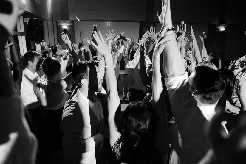 hands in the air at the woodlands at algonkian wedding